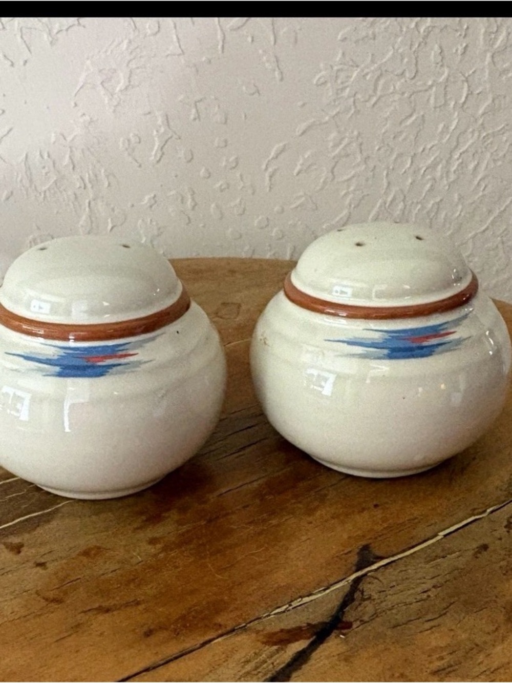 Noritake Radiance White Ceramic Salt and Pepper Shakers with Blue and Red Accent